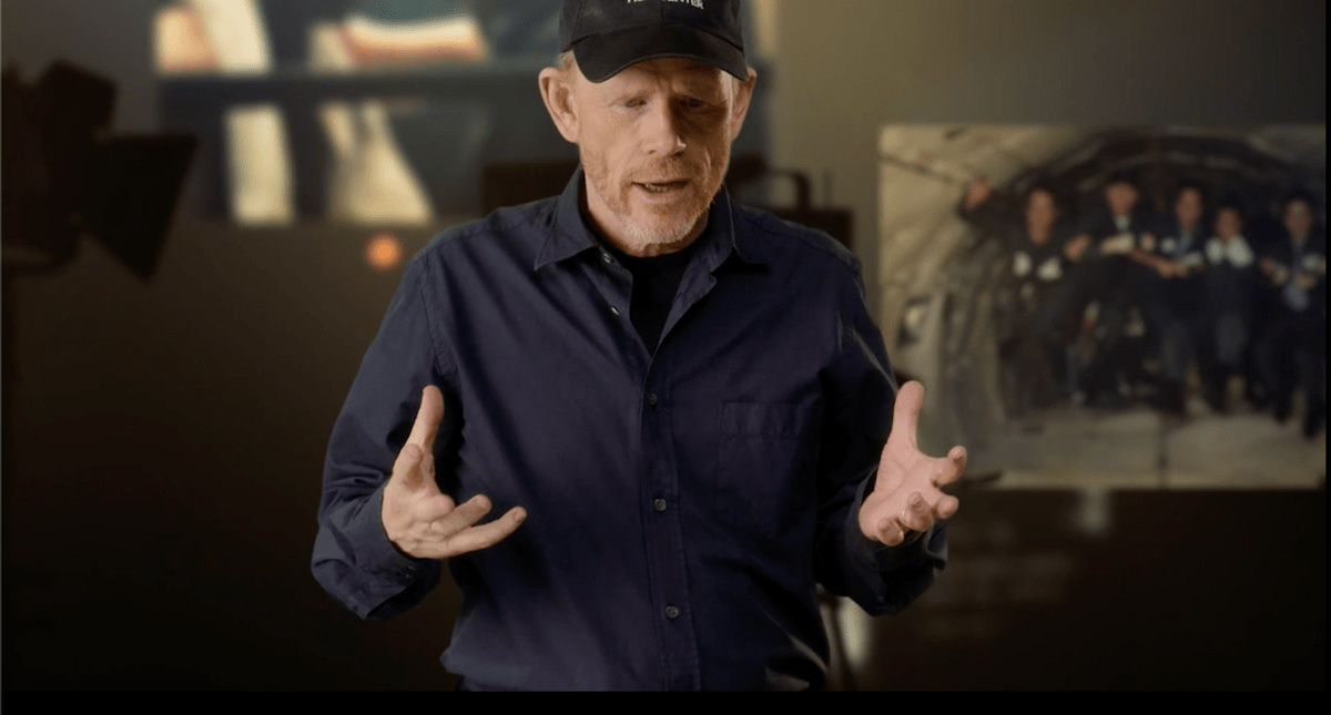 Ron Howard teaching his MasterClass in front of a background from Apollo 13