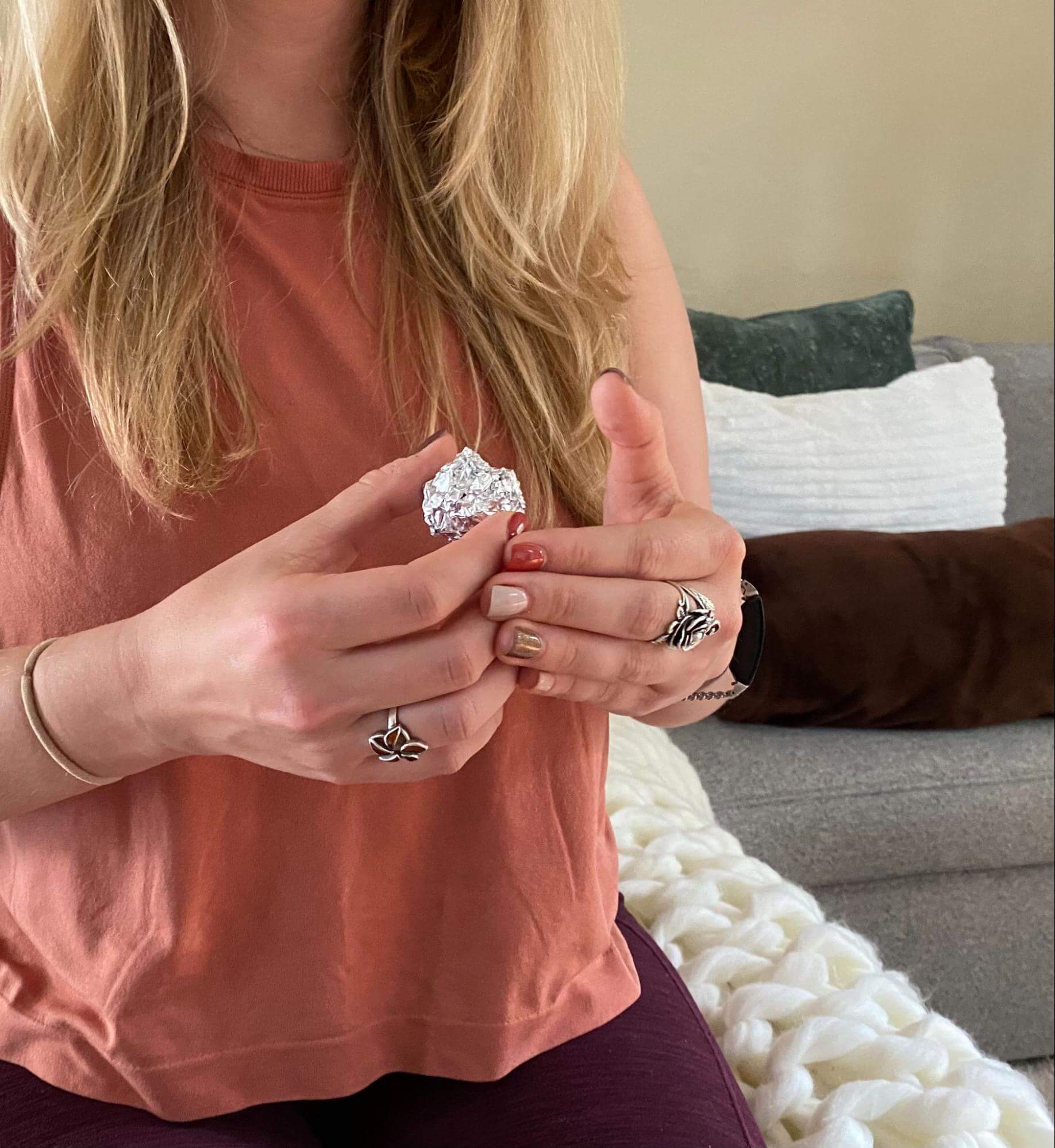 woman holding an aluminum ball