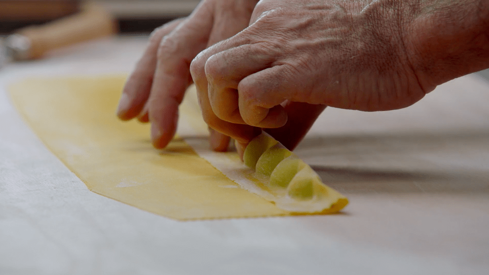 Image of Thomas Keller preparing his Agnolotti with pea filling