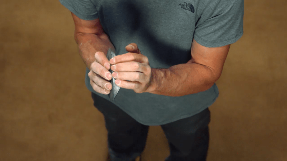 Image of Alex Honnold showing MasterClass users one of the ways to hold a crimp