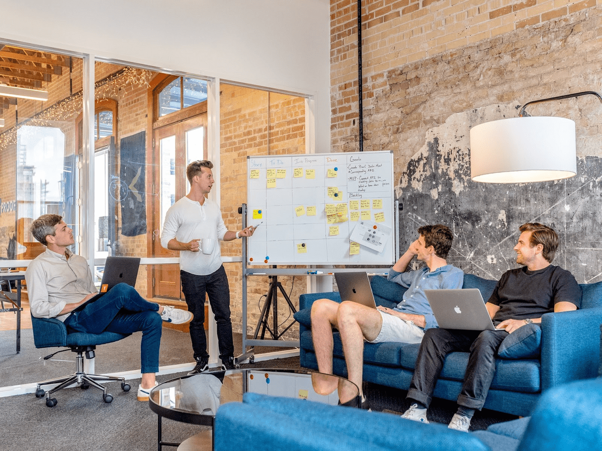Boardroom meeting around a whiteboard