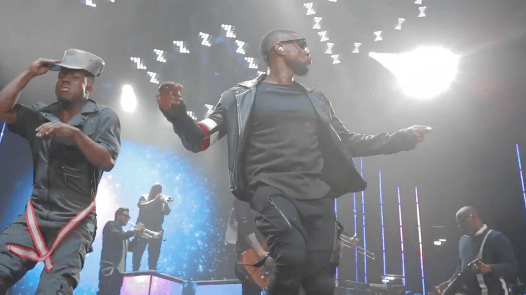 Usher dancing on stage